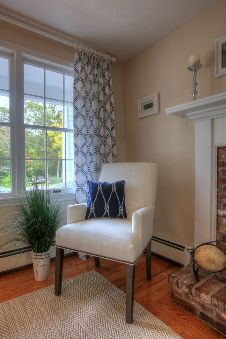 A comfy white chair in a stylish living room area